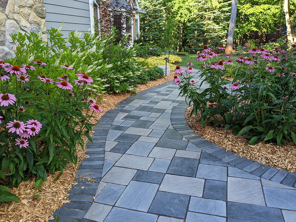 Image of a grey slate walkway, installed by BladeRunners Landscaping.