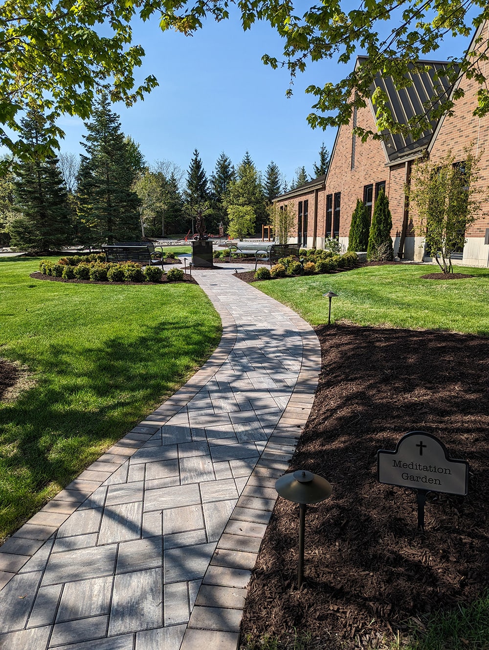 Image of a completed landscape installation project at St. James church by BladeRunners Landscaping.